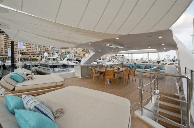 Sundeck sunpads and alfresco dining aboard motor yacht SCORPION