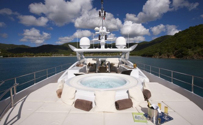 Sunpads and Jacuzzi on the upper deck of luxury yacht DESTINY
