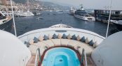 Anastasia at the Monaco Yacht Show 2017 - View of the mega yacht Jubilee in the background