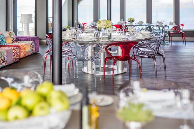 Formal dining in the main salon of superyacht SALUZI