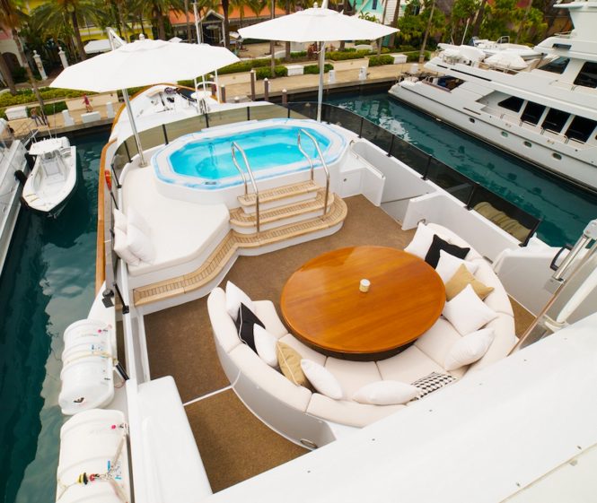 Forward sundeck dining and Jacuzzi aboard MY GRAND ILLUSION