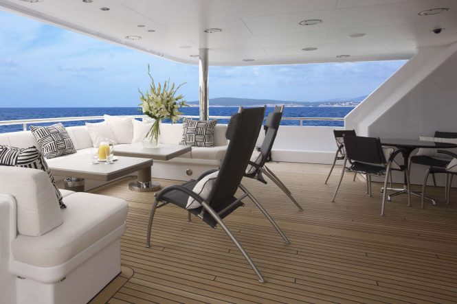 Main deck aft seating aboard motor yacht HURRICANE RUN. Photo credit: Feadship