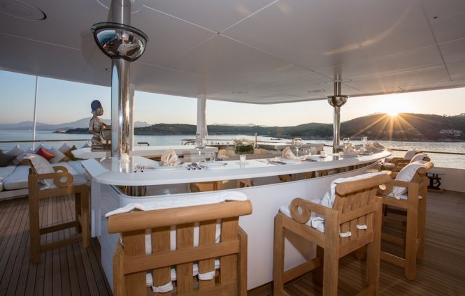 Superyacht CORAL OCEAN - Alfresco dining on the bridge deck aft. Image credit: Jeff Brown