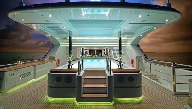 Large swimming pool aboard MARTHA ANN lit up after sunset