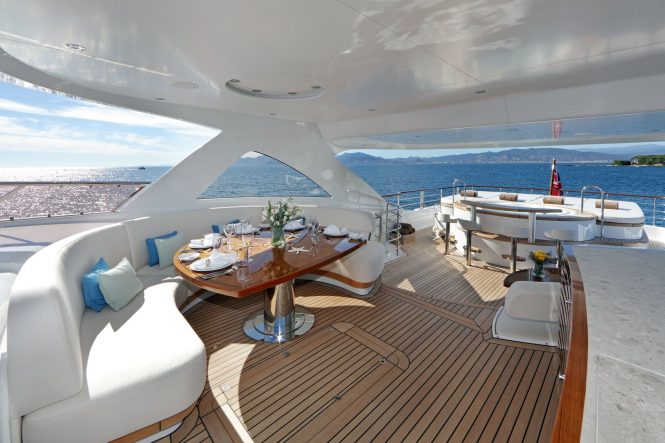 Sun deck with alfresco dining area and jacuzzi