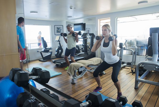 working out in the on board gym aboard CHAKRA