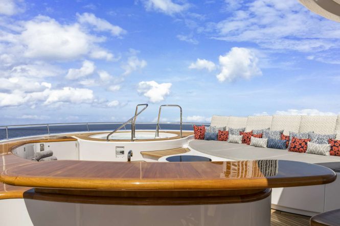 Jacuzzi with sun pads and plenty of lounging areas on board
