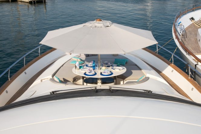 Foredeck with umbrella and dining area