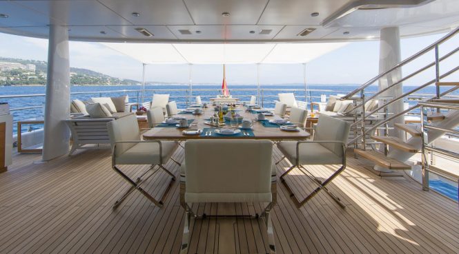 Spacious aft deck with a dining area to enjoy meals al fresco