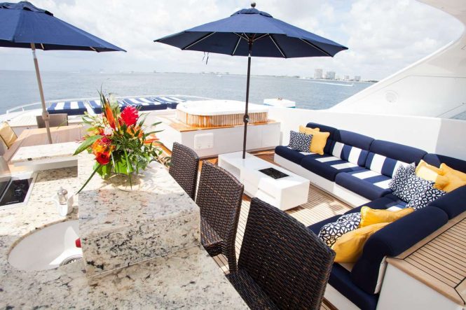 Sun deck Jacuzzi and seating area with a bar