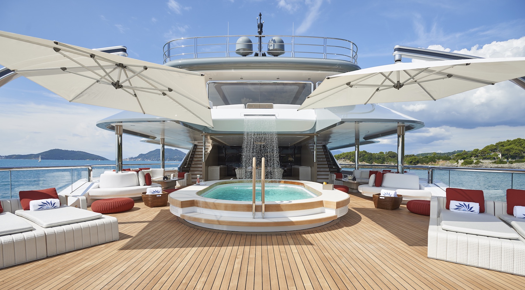super yacht with sailboat on deck