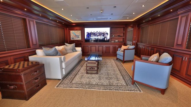 Classically styled sky lounge with a large TV