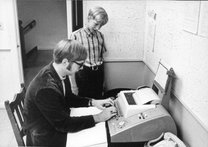 Paul Allen with Bill Gates in front of a teletype machine at the Lakeside School in 1970. Courtesy Lakeside School