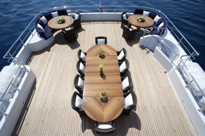 Top deck dining area with plenty of seating around the large table