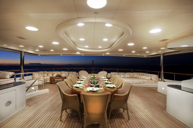 Aft deck alfresco dining area in the evening