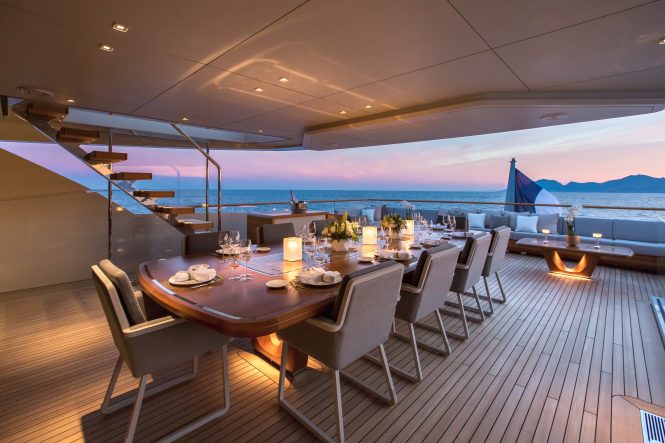 Aft deck alfresco dining set up in the evening