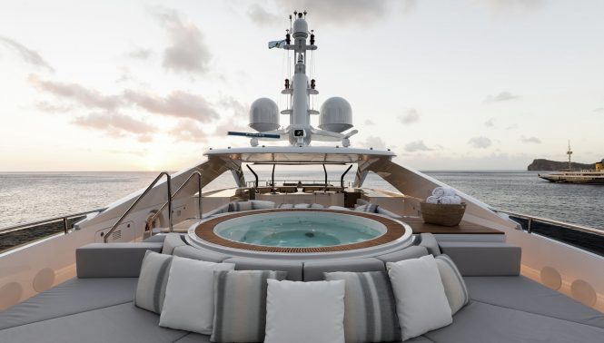 Jacuzzi on the sun deck with plenty of space to sunbathe and relax
