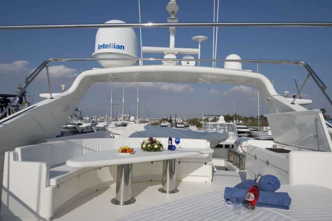 Flybridge with alfresco dining area and sunbathing area