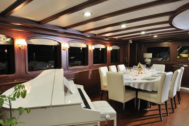 Formal dining area and a baby grand piano