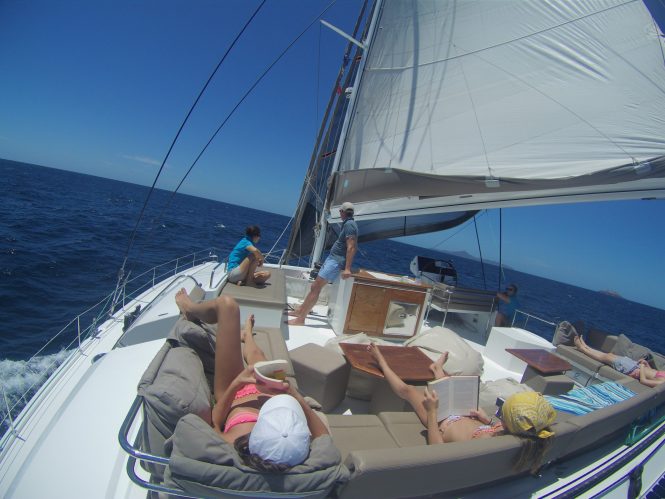 Sunbathing and relaxing on board