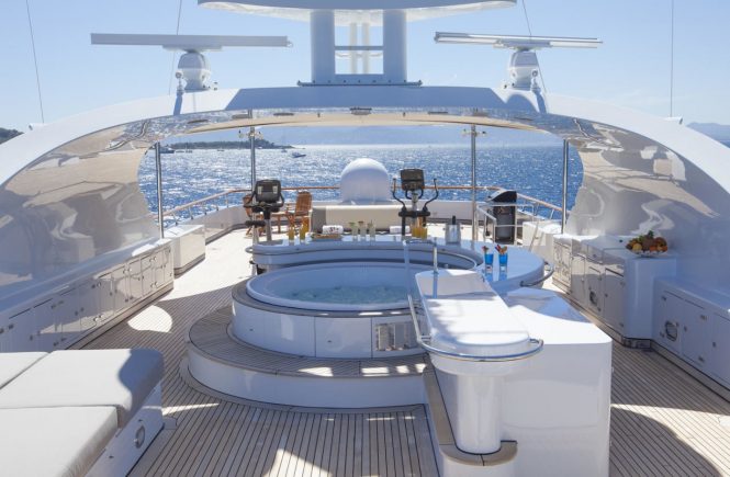 Sun deck with Jacuzzi and gym equipment