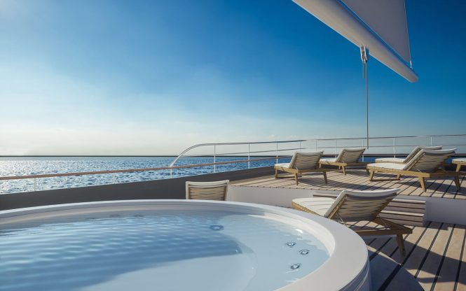 Jacuzzi and sunbathing area