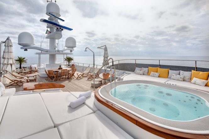Sun deck with Jacuzzi and seating to relax