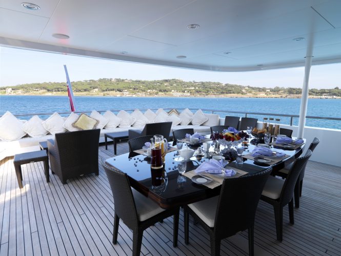 Aft deck alfresco dining area with a seating area