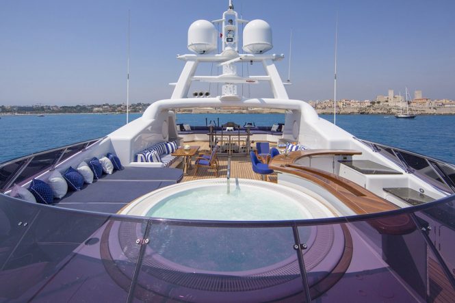 Sun deck with Jacuzzi, sunbathing area and a fitness area