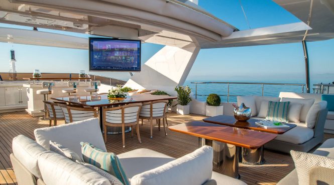 Sun deck offering alfresco dining and lounging areas
