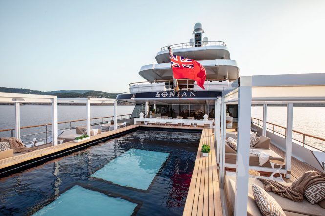 Amazing pool with seating and relaxation area around - Photo © Feadship