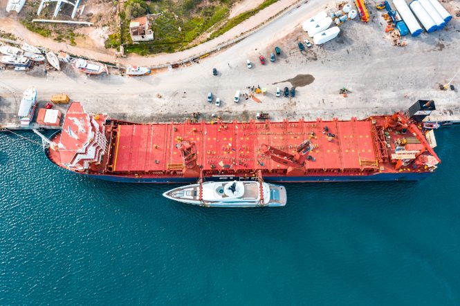 Snow 5 next to cargo ship