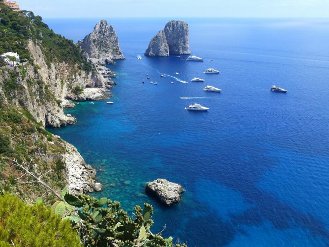 Yachts cruising near the island of Capri in Italy