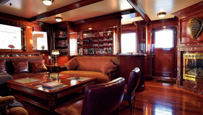Warm and inviting interiors include a saloon with a fireplace
