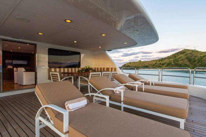 Aft deck with alfresco dining area and sunbathing area