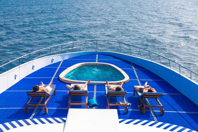 Yacht pool on deck with sun loungers