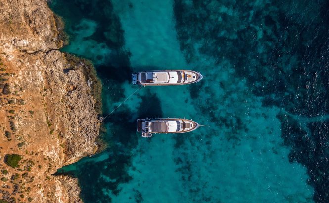 Aerial view of two yachts ©Mike Nahlii