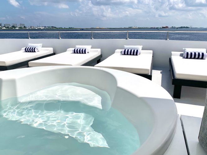 Jacuzzi and sunbathing area