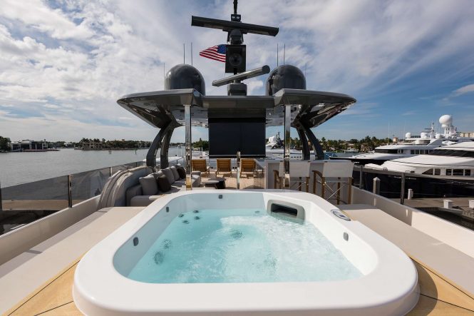 Jacuzzi on deck with sunbathing area