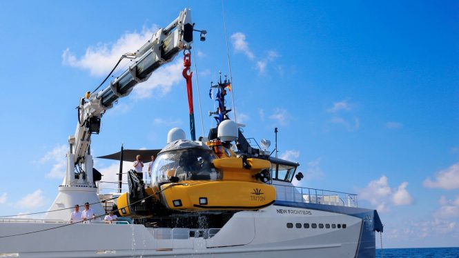 Triton submersible being launched by crane
