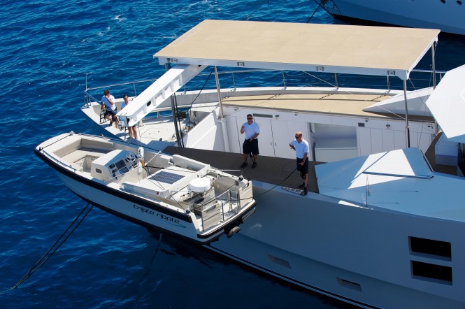 Tender Launching on the bow of motor yacht Big Fish Tender Launching on the bow of motor yacht Big Fish