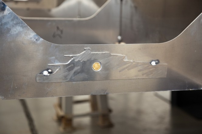 A good luck coin placed into IMEPRO 40 yacht's keel at the Tecnomar Shipyard in Italy