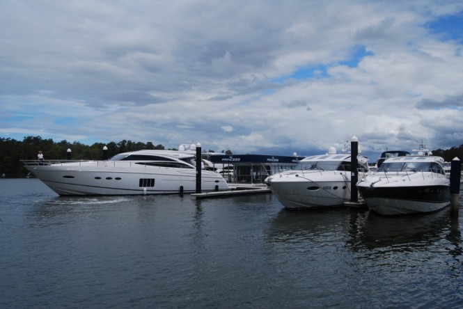 Luxury cruisers are moved into place at the Princess display including the new Princess V72 Luxury cruisers are moved into place at the Princess display including the new Princess V72