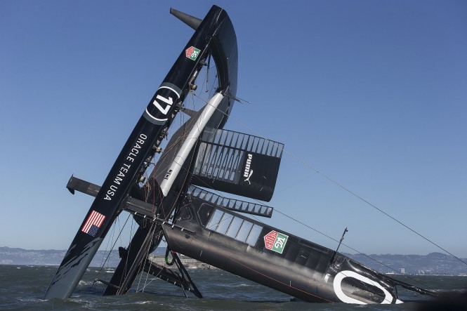 ORACLE TEAM USA capsizes its catamaran yacht AC72 on San Francisco Bay