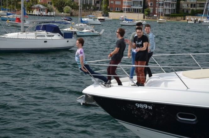 Posing as a figure head the boys have some fun on the bow of the 5800 Sport Yacht Buoy Toy