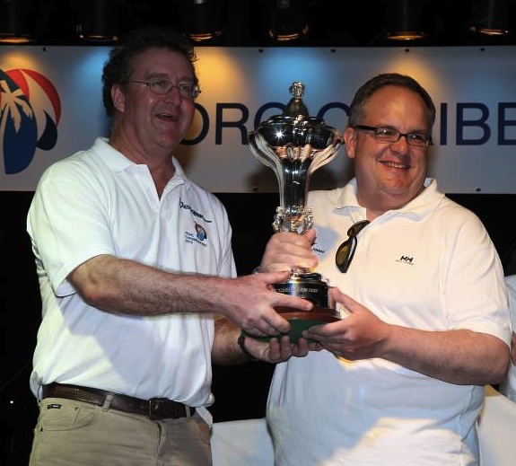 Mike Greville, RORC Commodore presents Ron O'Hanley with the RORC Caribbean 600 Trophy Credit: Tim Wright/Photoaction.com Mike Greville, RORC Commodore presents Ron O'Hanley with the RORC Caribbean 600 Trophy Credit: Tim Wright/Photoaction.com