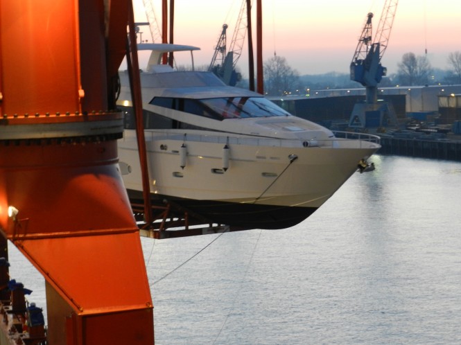 Monte Fino 76 yacht being unloaded from the hold into the River Rhine Monte Fino 76 yacht being unloaded from the hold into the River Rhine
