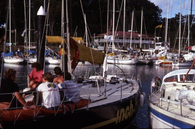The fleet at rest: The crew of Joe Goddard’s Inch by Winch – one of the 93 yachts at the inaugural Hamilton Island Race Week in 1984 – relax on the foredeck post-race inside Hamilton Island’s harbour. (Image: Sandy Peacock) The fleet at rest: The crew of Joe Goddard’s Inch by Winch – one of the 93 yachts at the inaugural Hamilton Island Race Week in 1984 – relax on the foredeck post-race inside Hamilton Island’s harbour. (Image: Sandy Peacock)