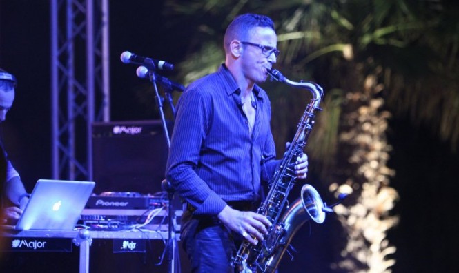 The saxophonist takes centre stage at the beach club party The saxophonist takes centre stage at the beach club party
