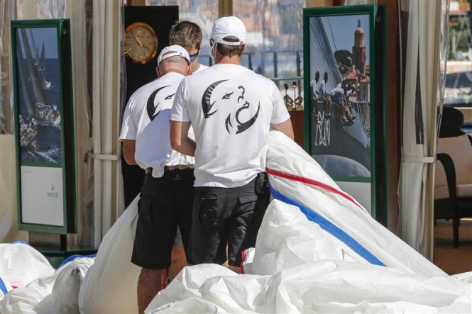Crew members of Lupa of London yacht during sail measurement on Piazza Azzurra Crew members of Lupa of London yacht during sail measurement on Piazza Azzurra
